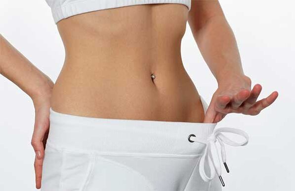 Tight belly of a slim girl.